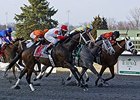 We Miss Artie (left) comes on late to take the Spiral Stakes at Turfway.
