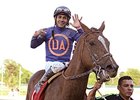 Jockey Paco Lopez celebrates 7 wins on the day.
