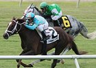 Channel Lady comes on late to win the Edward P. Evans All Along Stakes.