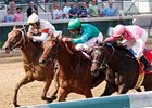 Just Louise (center) outfights Salty Strike (rail) and Tristanme to win the Debutante.