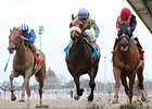 Snuggs and Kisses (right) fights off Daisy Devine to win the Bayou Handicap.