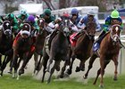 Love to Tell (right) leads the pack in the Bayou Handicap.