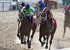 Infrattini (left) fights off Mark Valeski to win the Louisiana Handicap.