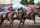Toccetive (left) rolls late to win the Canadian Derby.