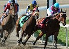 Daisy Devine (center, Blue & Yellow silks) begins the winning move in the Fair Ground Oaks.