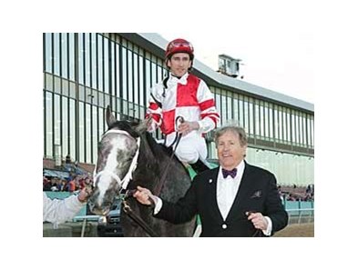 Owner Rick Porter leads Southwest Stakes winner Old Fashioned and jockey Ramon Dominguez into the winners circle.
