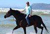Ebony Flyer and trainer Justin Snaith at the beach in Cape Town.