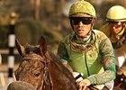 Garrett Gomez, shown aboard Tiz a Minister, won both divisions of the California Breeders Champion Stakes.