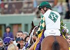 Kathy Ritvo congratulations Gary Stevens after Mucho Macho Man's win in the Classic.<br><a target="blank" href="http://photos.bloodhorse.com/BreedersCup/2013-Breeders-Cup/Classic/33150031_7ZnLk4#!i=2880911124&k=bVwvNFs">Order This Photo</a>