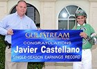 Javier Castellano (with Racing Secretary PJ Campo) celebrates the Earnings Record.