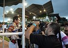 The press talks with jockey Moises Gonzalez following the Clasico del Caribe.