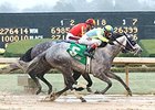 Race Day fights off Midnight Hawk to win the Razorback Handicap.