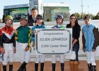 Julien Leparoux (center, green and blue silks) celebrates win 2000 with his fellow jockeys.