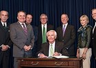 Kentucky Gov. Steve Beshear signs Breeders' Cup Tax Exemption Bill.