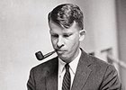 A young Kent Hollingsworth writing on a typewriter.