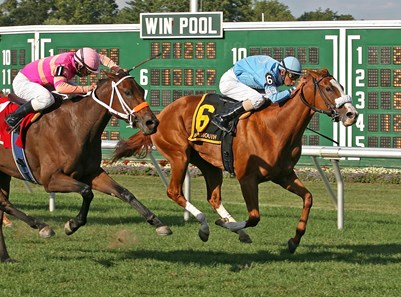Grecian Maiden and jockey Julian Pimentel edge out Profiteroles to win the 2010 $100,000 Twin Lights Stakes at Monmouth Park.