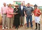 Mac Robertson, gray shirt, and connections of Somerset Swinger after the $55,000 Bella Notte Distaff Sprint.