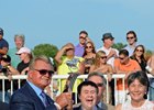 Caption: Mike Ditka, presenter left, with Andrew Bentley and his parents, Mr. and Mrs. Greg Bentley.
Hardest Core with Eriluis Vaz wins the ARlington Million. Aug. 16, 2014
photo by Anne M. Eberhardt