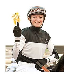 Jockey Amelia Green celebrates her first win.