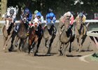 The field comes around the final turn in the Travers Stakes at Saratoga Race Course in New York.