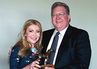 LTBA President Dr. Dexter Gary presents the 2012 Louisiana Horse of the Year award to Evelyn Benoit of Brittlyn Stables for Star Guitar.