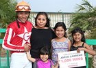 Jockey Jorge Carreno celebrates his 1,000th career win.
