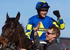 Ryan Mania celebrates after winning the Grand National aboard Auroras Encore.