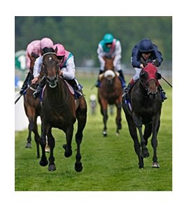 Twice Over (left) leads the way to victory in the Coral-Eclipse Stakes. <br><a target="blank" href="http://www.bloodhorse.com/horse-racing/photo-store?ref=http%3A%2F%2Fpictopia.com%2Fperl%2Fgal%3Fprovider_id%3D368%26ptp_photo_id%3D9094352%26ref%3Dstory">Order This Photo</a>