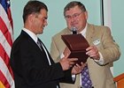 Jeremy Best (left) receives the Race Track Chaplaincy of America's 2011 White Horse Award.