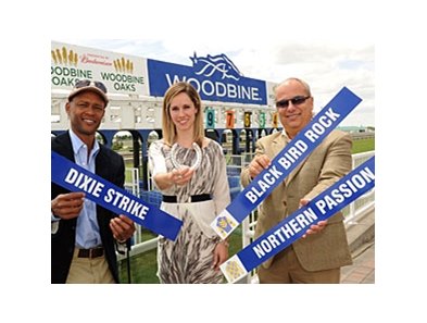 Trainer Mark Casse (right) has Dixie Strike, Northern Passion, and Black Bird Rock in the Woodbine Oaks. Patrick Husbands (left) rides Dixie Strike.