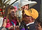 Doug O'Neill kissing the Kentucky Derby trophy.
<br><a target="blank" href="http://photos.bloodhorse.com/TripleCrown/2012-Triple-Crown/Kentucky-Derby-138/22650475_kRGdZF#!i=1830903089&k=w43TjHC">Order This Photo</a>