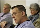 Roy Jackson, left, and Gretchen Jackson, right, listen as Dr. Dean Richardson speaks during a press conference Monday. All three appeared on "Larry King Live" Tuesday night.