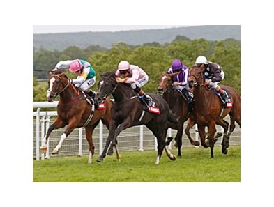 The Fugue (right, pink silks) overtakes Timepiece (left) to win the Nassau Stakes.<br><a target="blank" href="http://photos.bloodhorse.com/AtTheRaces-1/at-the-races-2012/22274956_jFd5jM#!i=2005841112&k=RRsMqHB">Order This Photo</a>