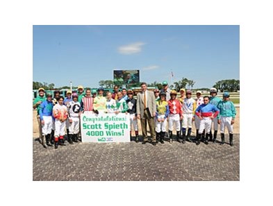 Scott Spieth celebrates with his fellow riders after win number 4,000.