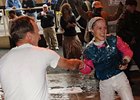 Jackie Davis is "congratulated" by her fellow jockeys after getting her first win.