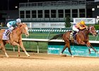 Machen (left) rolls late to defeat Dominus in the Derby Trial.