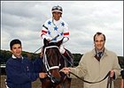 Joe Torre, right, part owner of Sugar Punch, walks the horse to the winner's circle after Sugar Punch, ridden by Edgar Prado, won the Iroquois Stakes at Belmont Park.