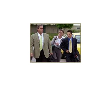 Jockey Jose Santos, right, arrives at the Churchill Downs racing office for a meeting with track stewards along with his attorney Karen Murphy, center, and agent Mike Sellitto.