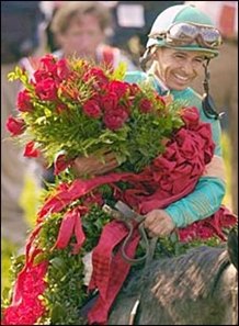 Jockey Mike Smith, with blanket of roses after winning the Kentucky Derby.