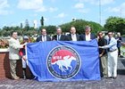 Calder staff and management join NTRA Safety & Integrity Alliance Executive Director Mike Ziegler in the Winner's Circle to celebrate the track's accreditation.