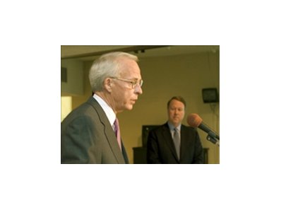 CDI's President and CEO Tom Meeker, foreground, announces the agreement to sell Hollywood Park to Bay Meadows Land Co., whose president, Terry Fancher, looks on.