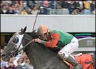 Russell Baze guides Adreamisborn to victory in the Longacres Mile.