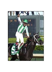 Victor Espinoza celebrates as War Emblem wires the field in the 2002 Kentucky Derby.