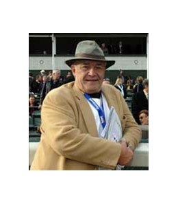 Bill Nack leans against the rail on Breeders' Cup Day at Churchill Downs.