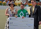Kent Desormeaux with the Jockey Challenge winning check.