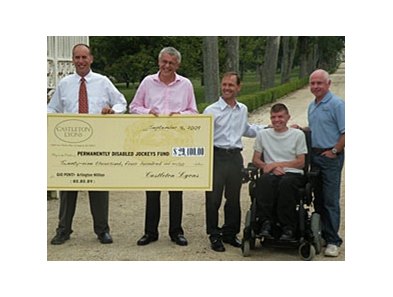 Castleton Lyons presents a check for $29,400 to the Permanently Disabled Jockeys Fund.