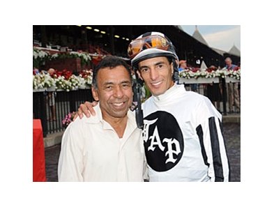 John Velazquez (right) is congratulated by Angel Cordero Jr, after moving into the No. 2 spot among the all-time leading jockeys at Saratoga Race Course.
