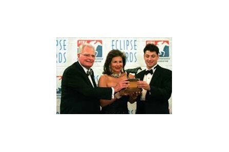 William, Suzanne, and Andrew Warren hold the Eclipse Award for Champion Older Male and Horse of the Year Saint Liam.