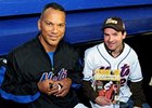 Desormeaux and Alou exchange autographs.