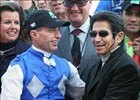 Russell Baze, left, receives congratulations from retired jockey and former record holder Laffit Pincay Jr.